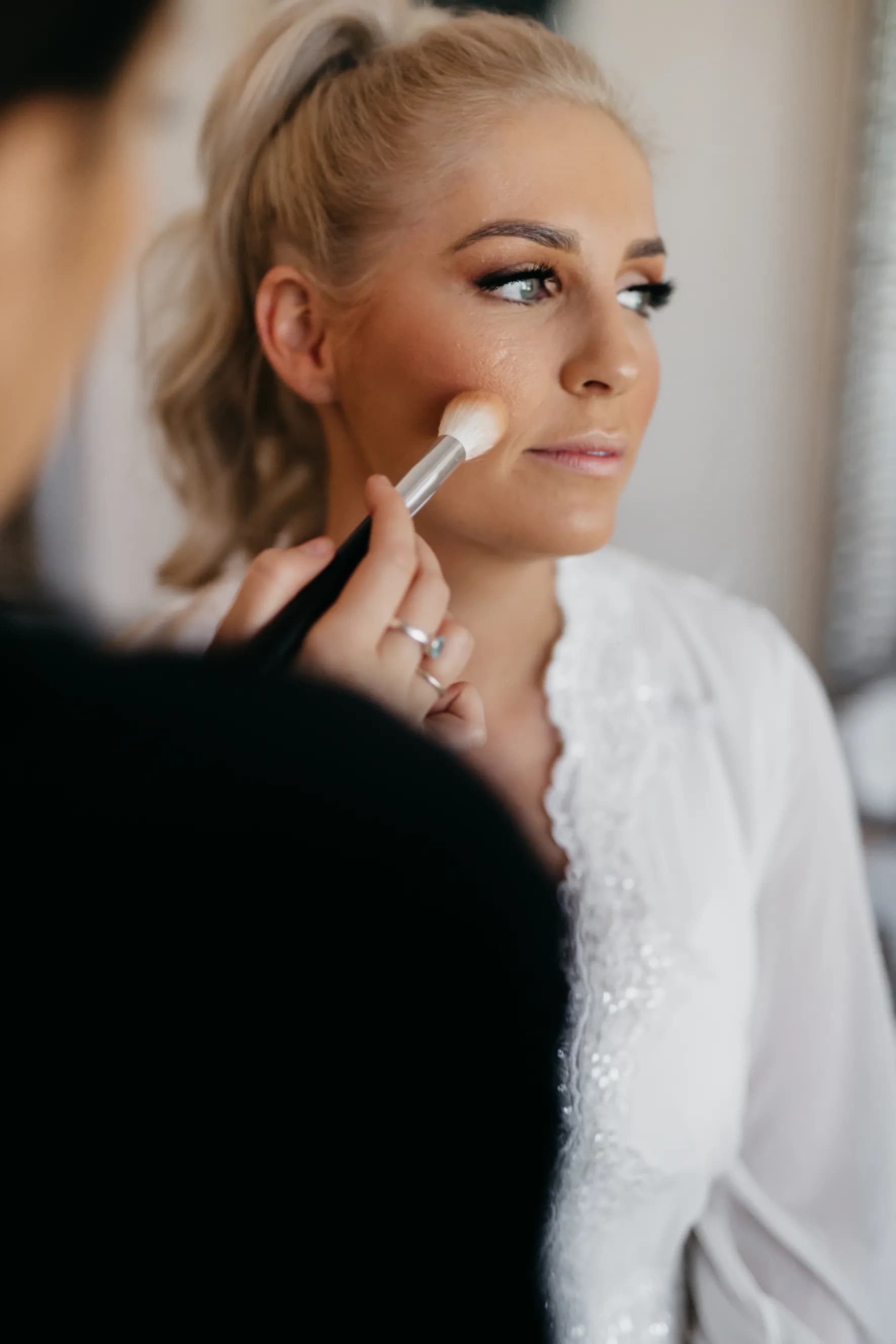 Bride getting makeup done
