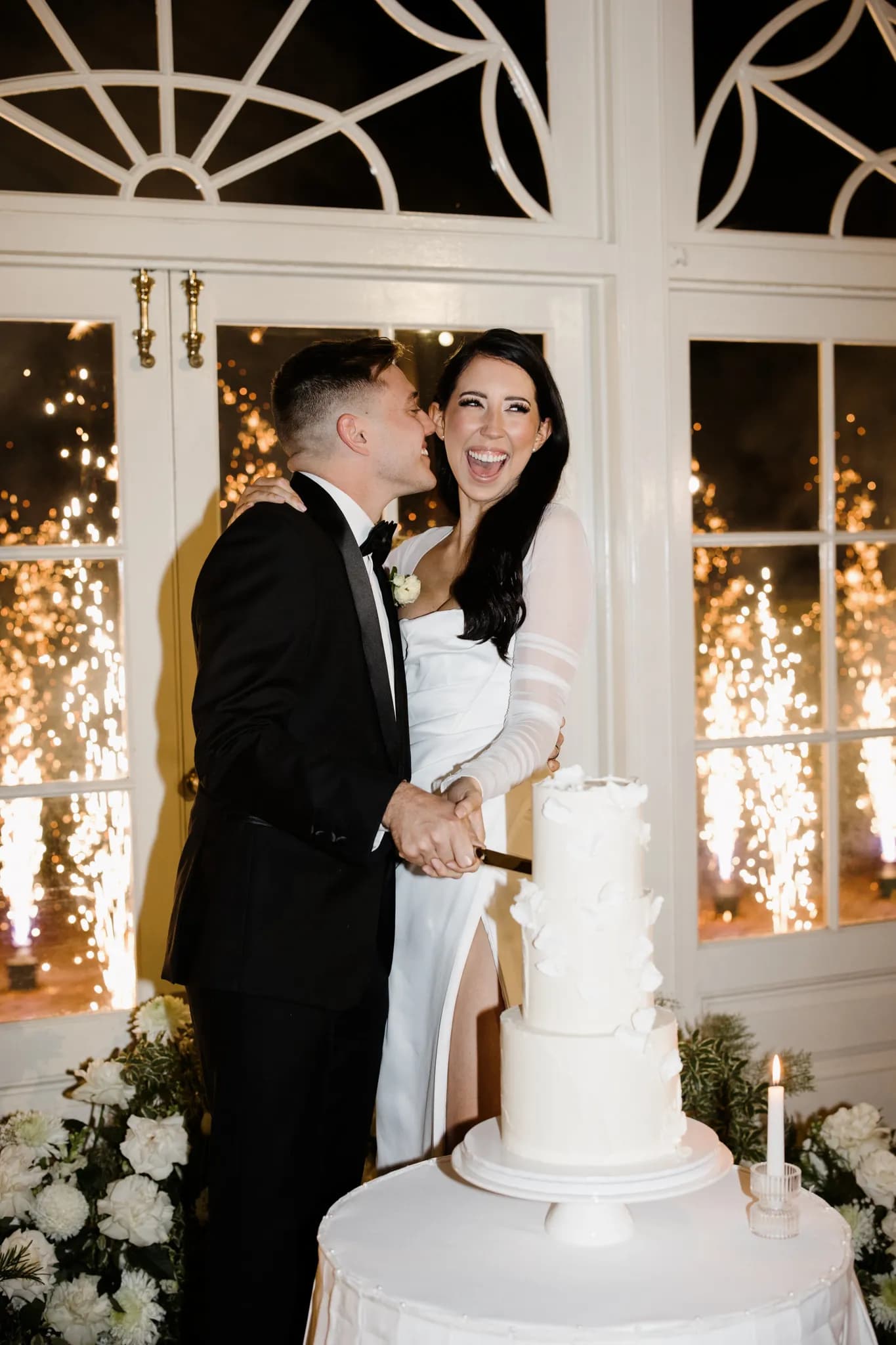 Bride and groom cutting cake