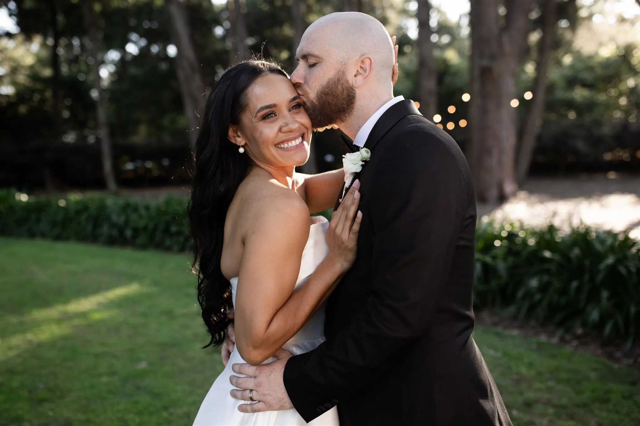 Bride and groom kissing
