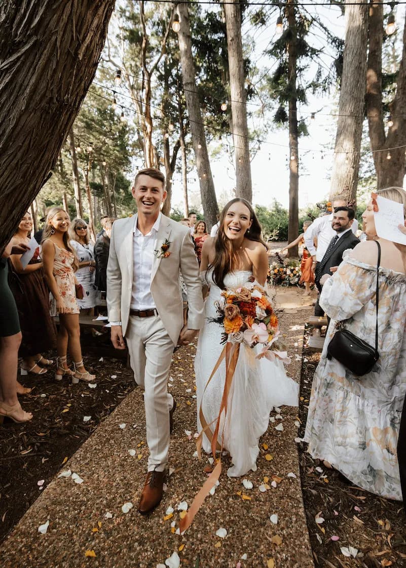 Bride and groom walking down aisle