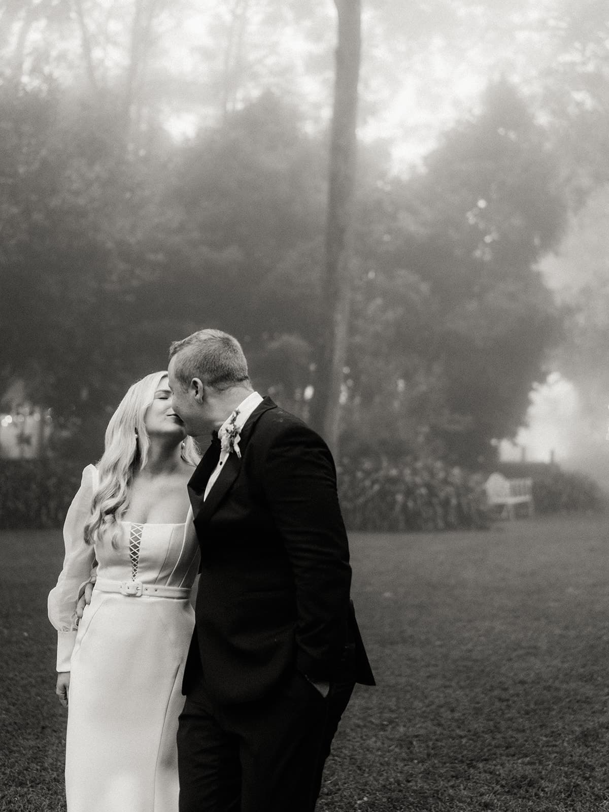 Bride and groom walking and kissing