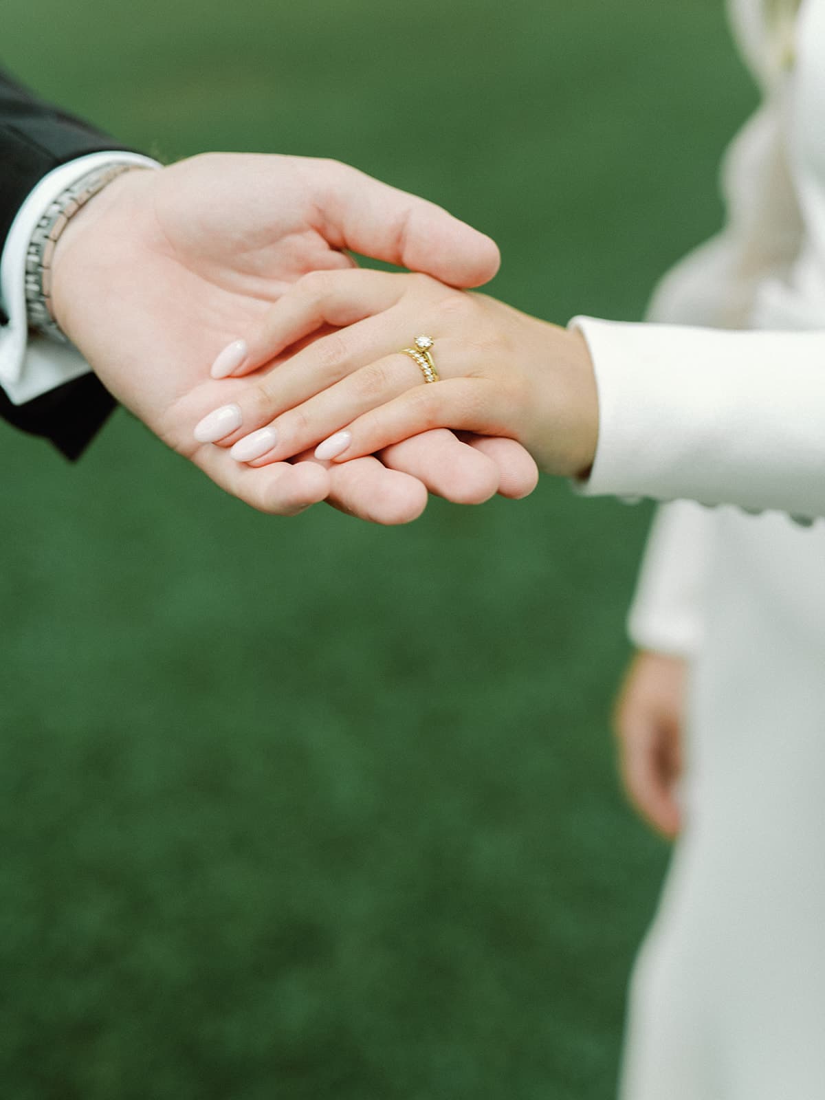 Bride and groom holding hands