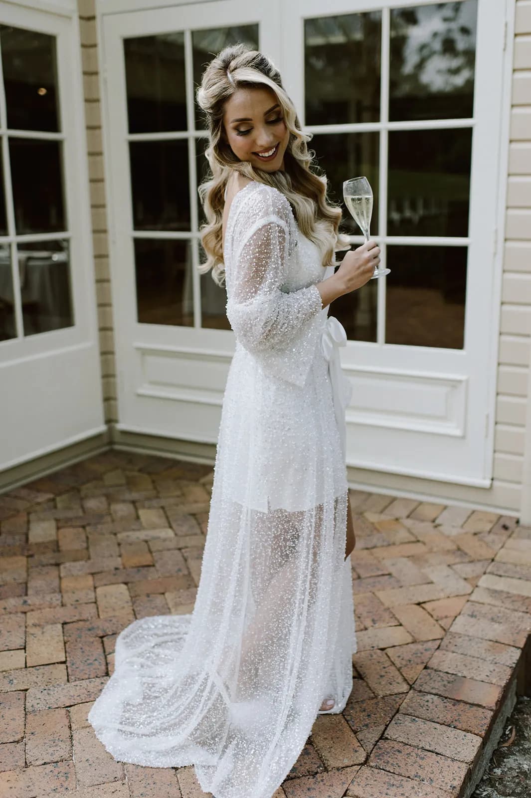 Bride holding champagne