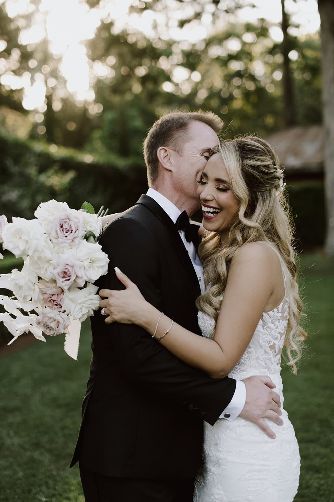 Bride and groom embracing