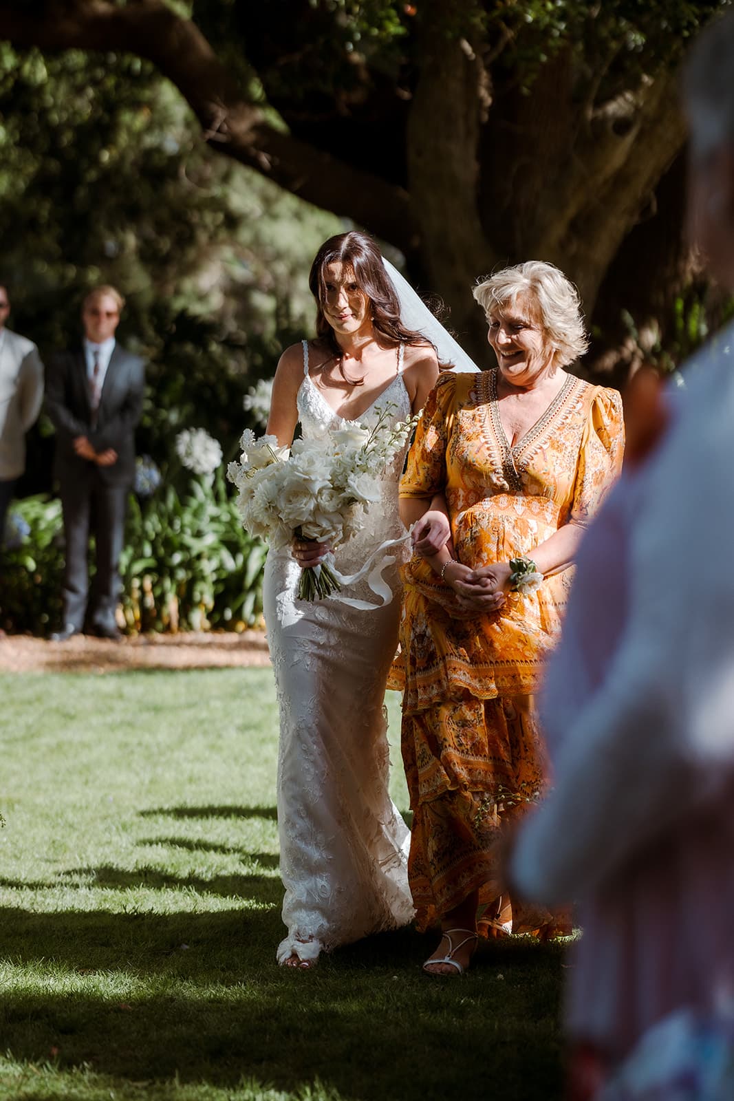 Bride and mother of the bride walking down the aisle