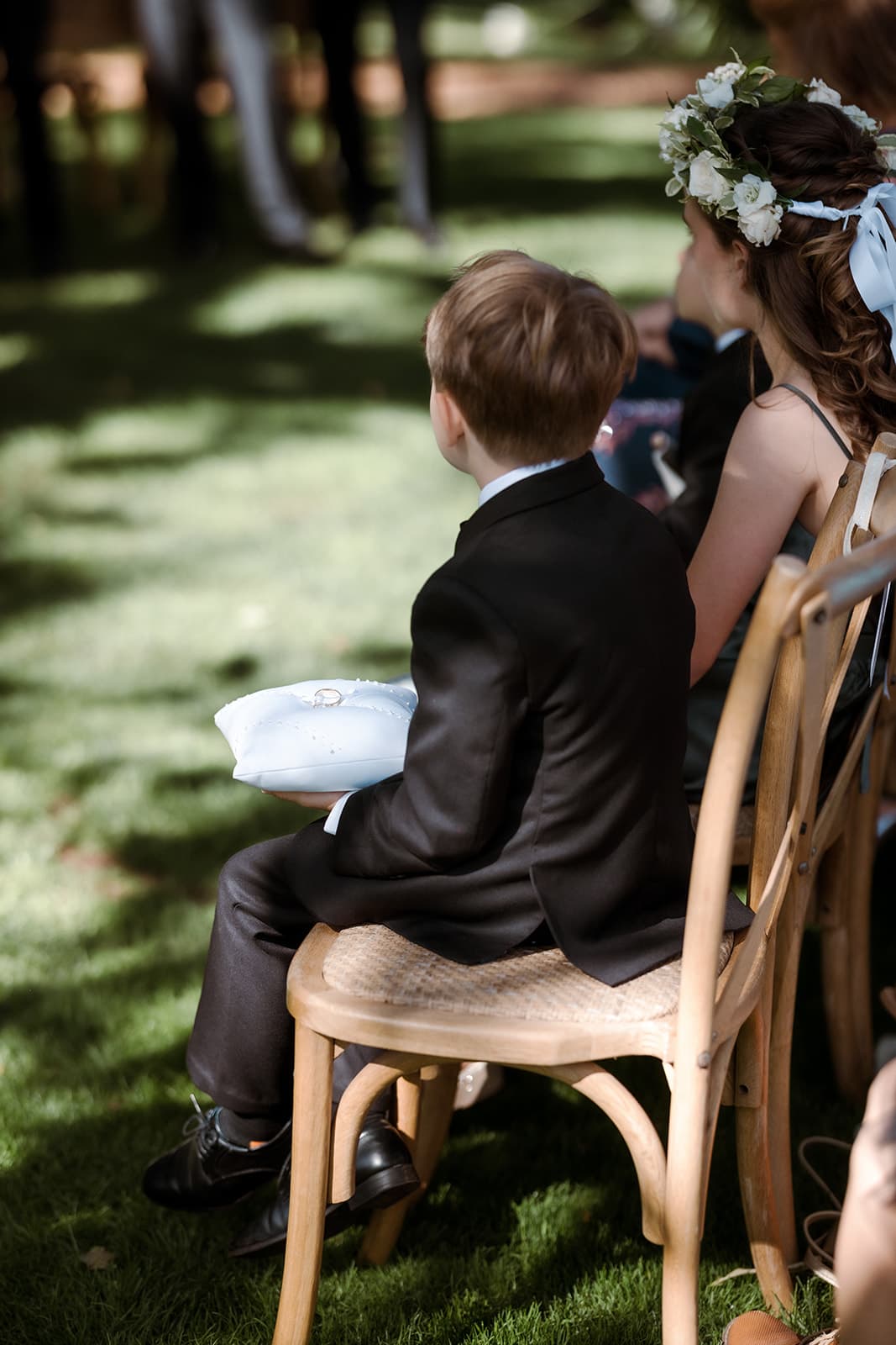 Boy holding pillow with ring on it
