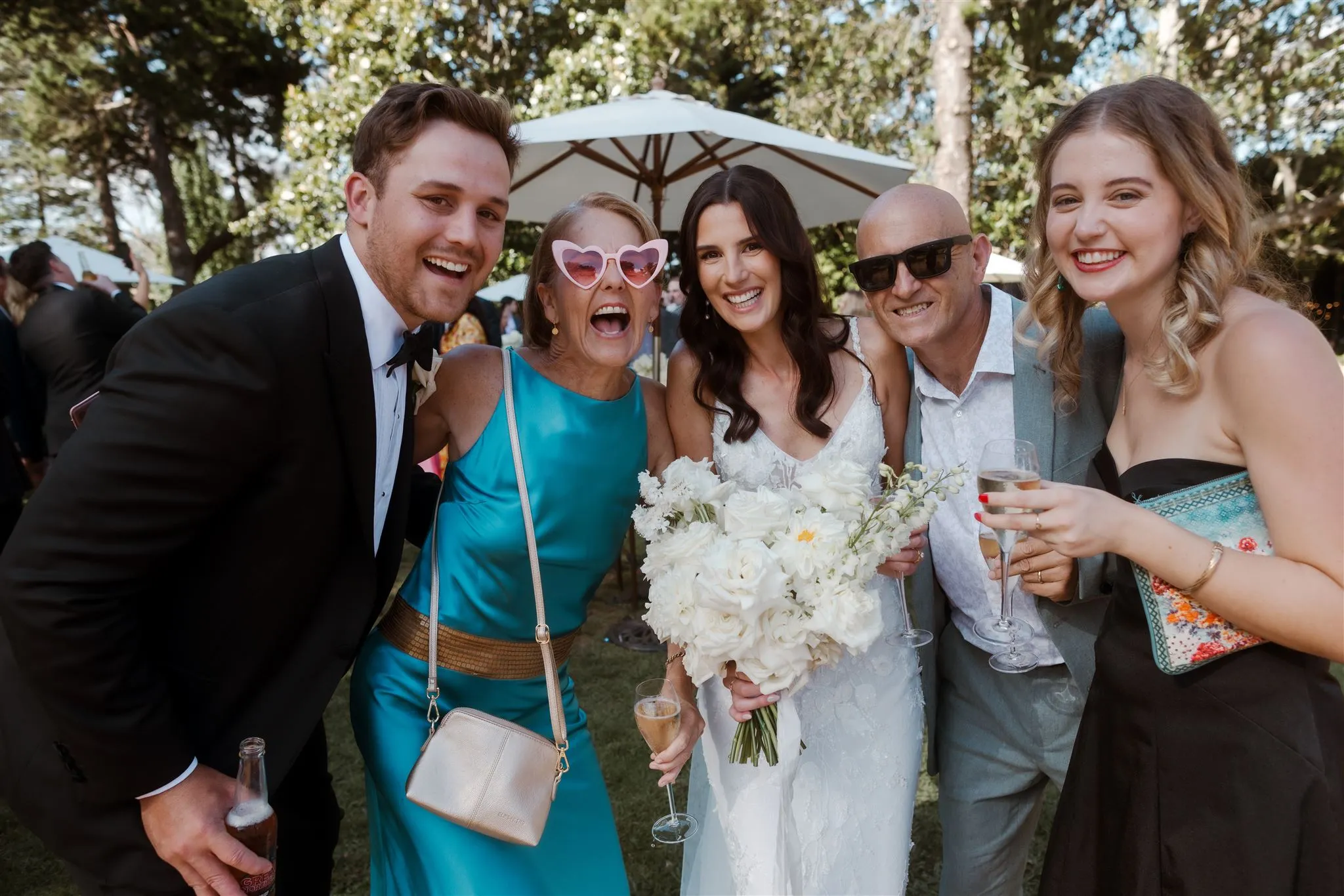 Bride and groom at wedding with guests