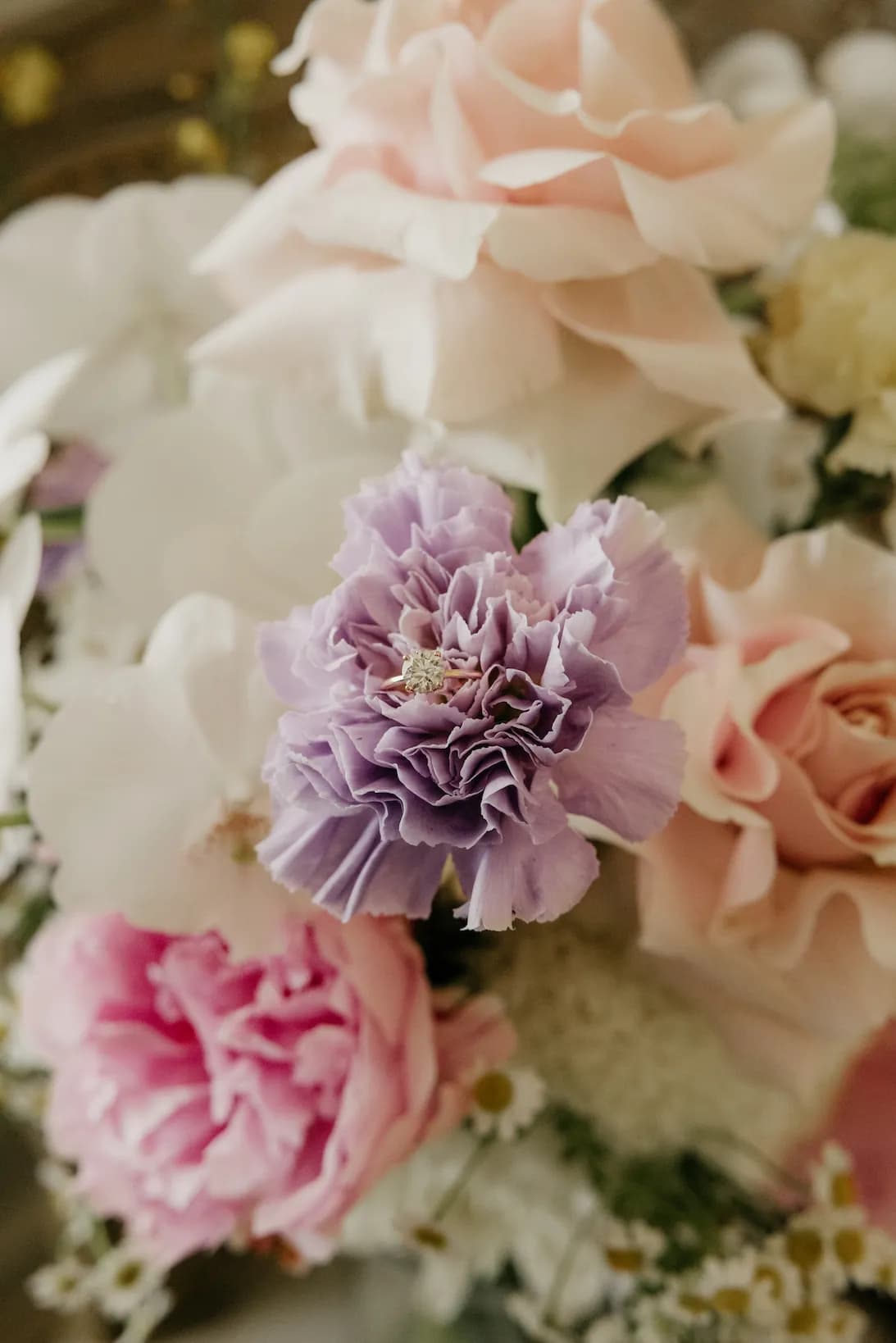 Coloured flowers and wedding ring