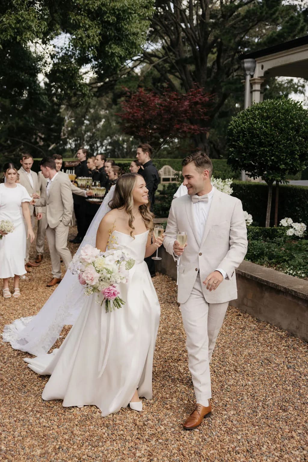 Bride and groom having champagne