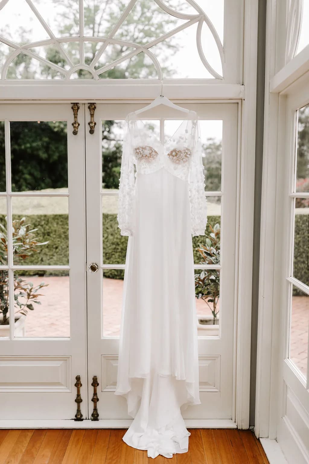 Wedding dress hanging on door