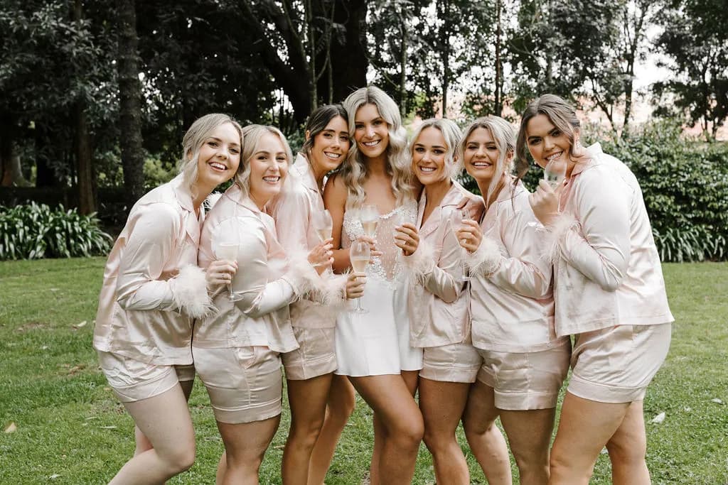 Bride and bridesmaids in gardens