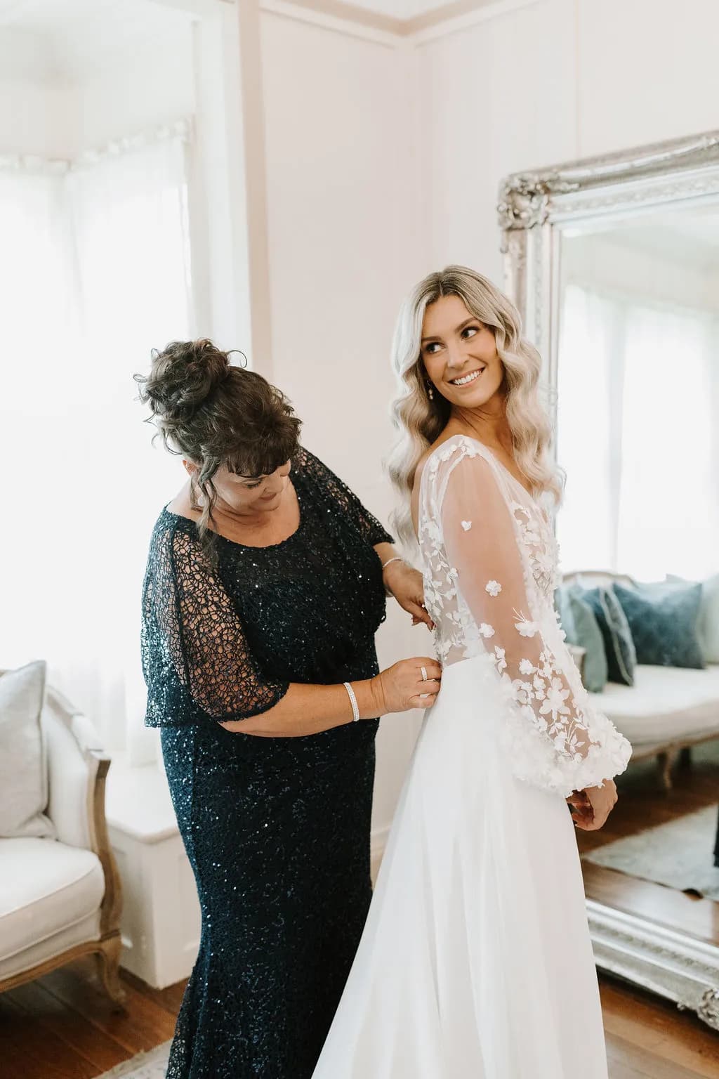 Mother of bride doing brides dress up