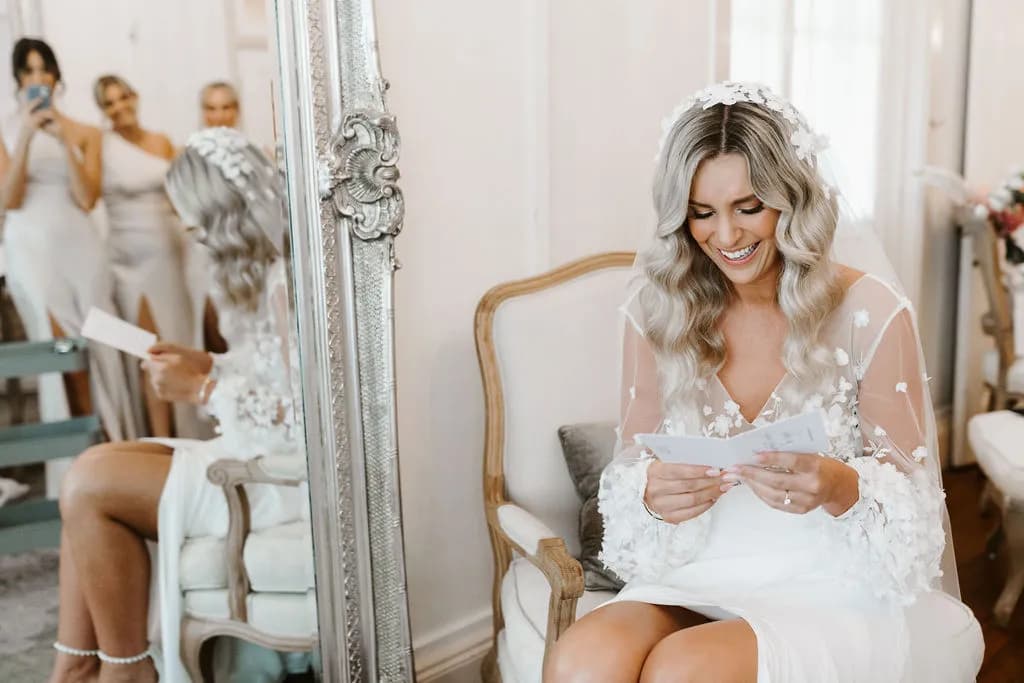 Bride reading card from groom