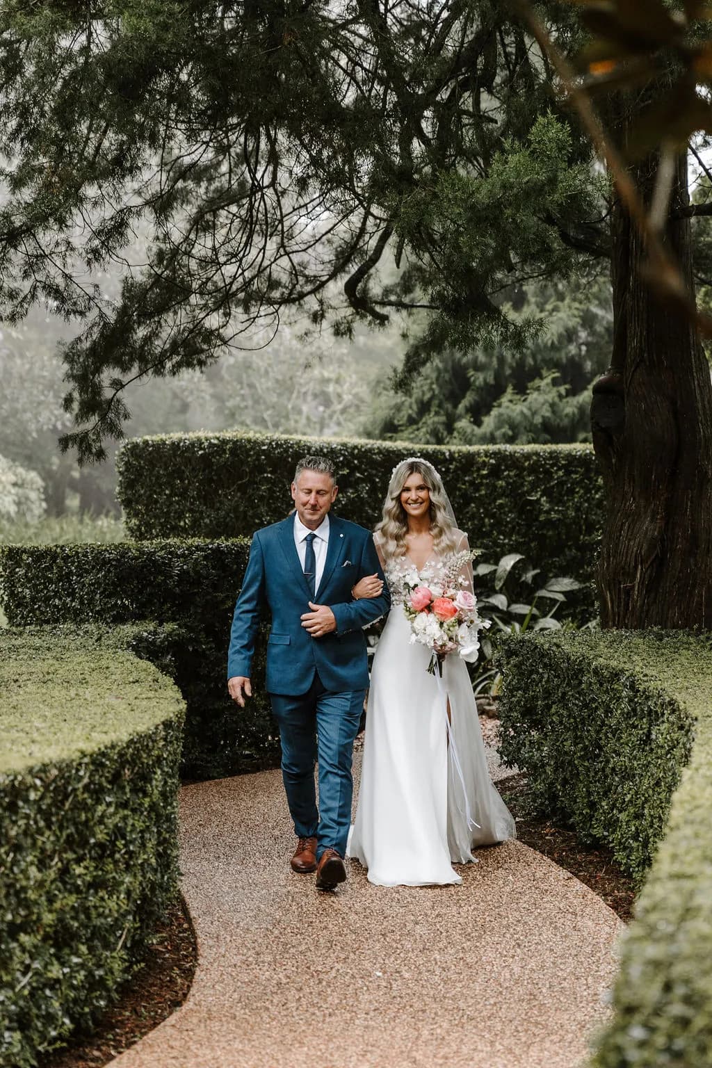 Bride and father walking down the aisle