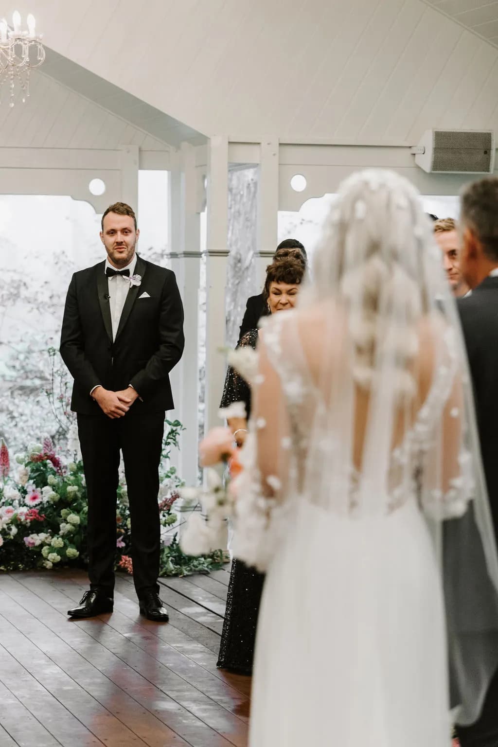 Bride walking down the aisle towards groom