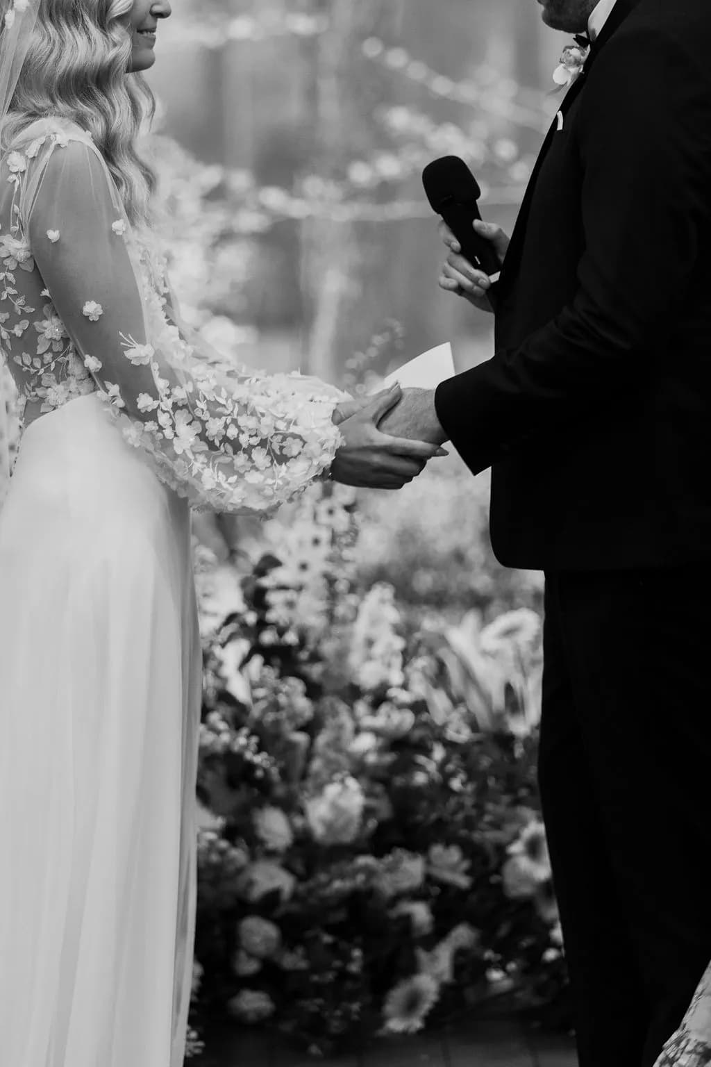 Bride and groom holding hands