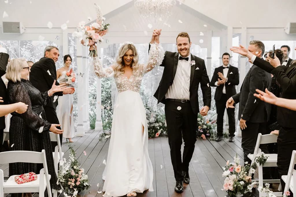 Bride and groom walking down the aisle