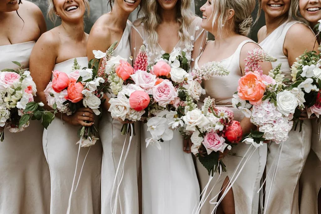 Bride and bridesmaids holding bouquets