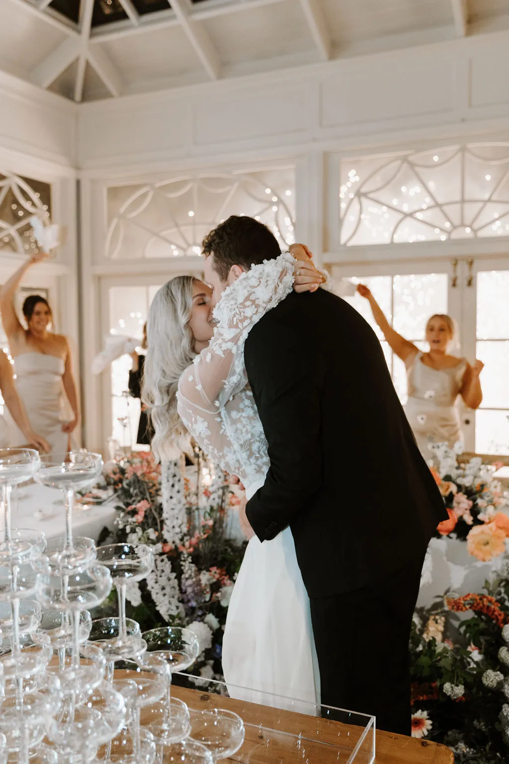 Bride and groom kissing in wedding reception