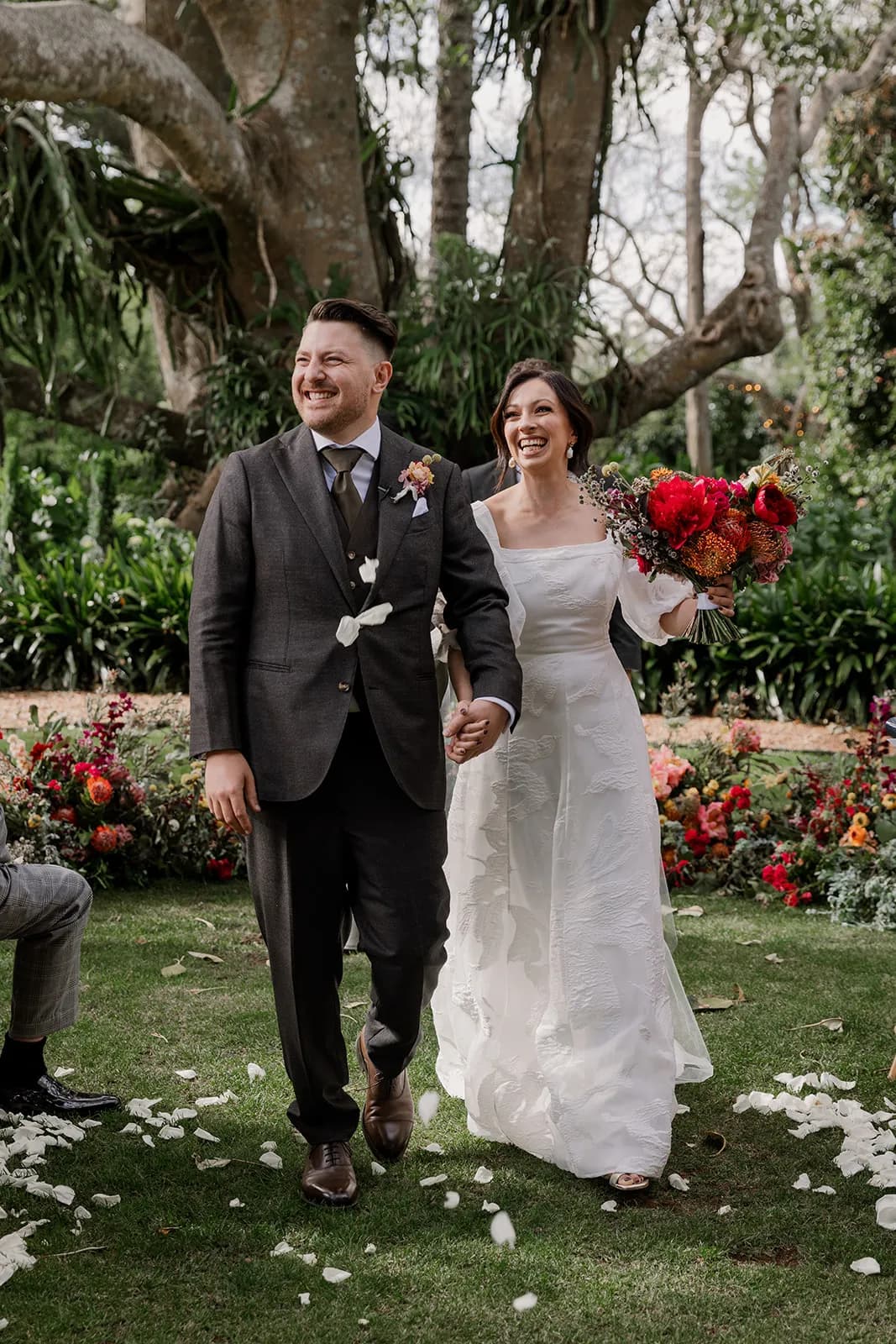Bride and groom walking down the aisle