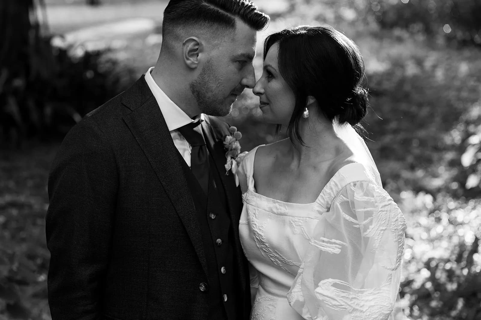 Bride and groom looking into each others eyes