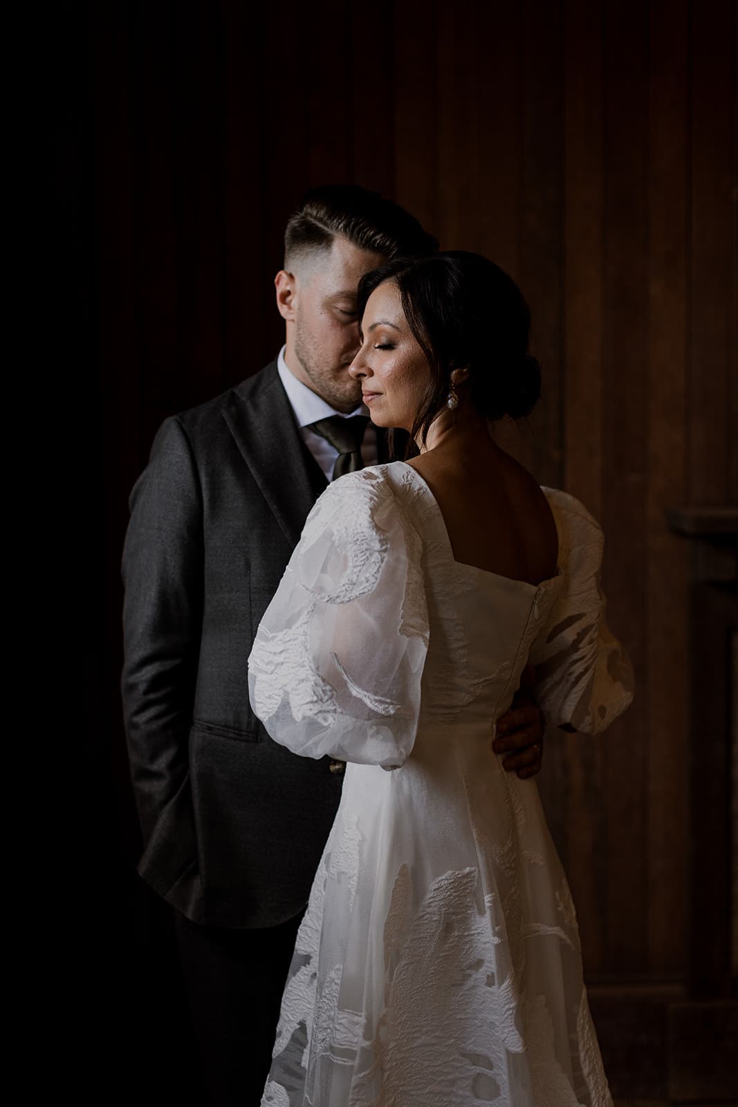 Bride and groom embracing