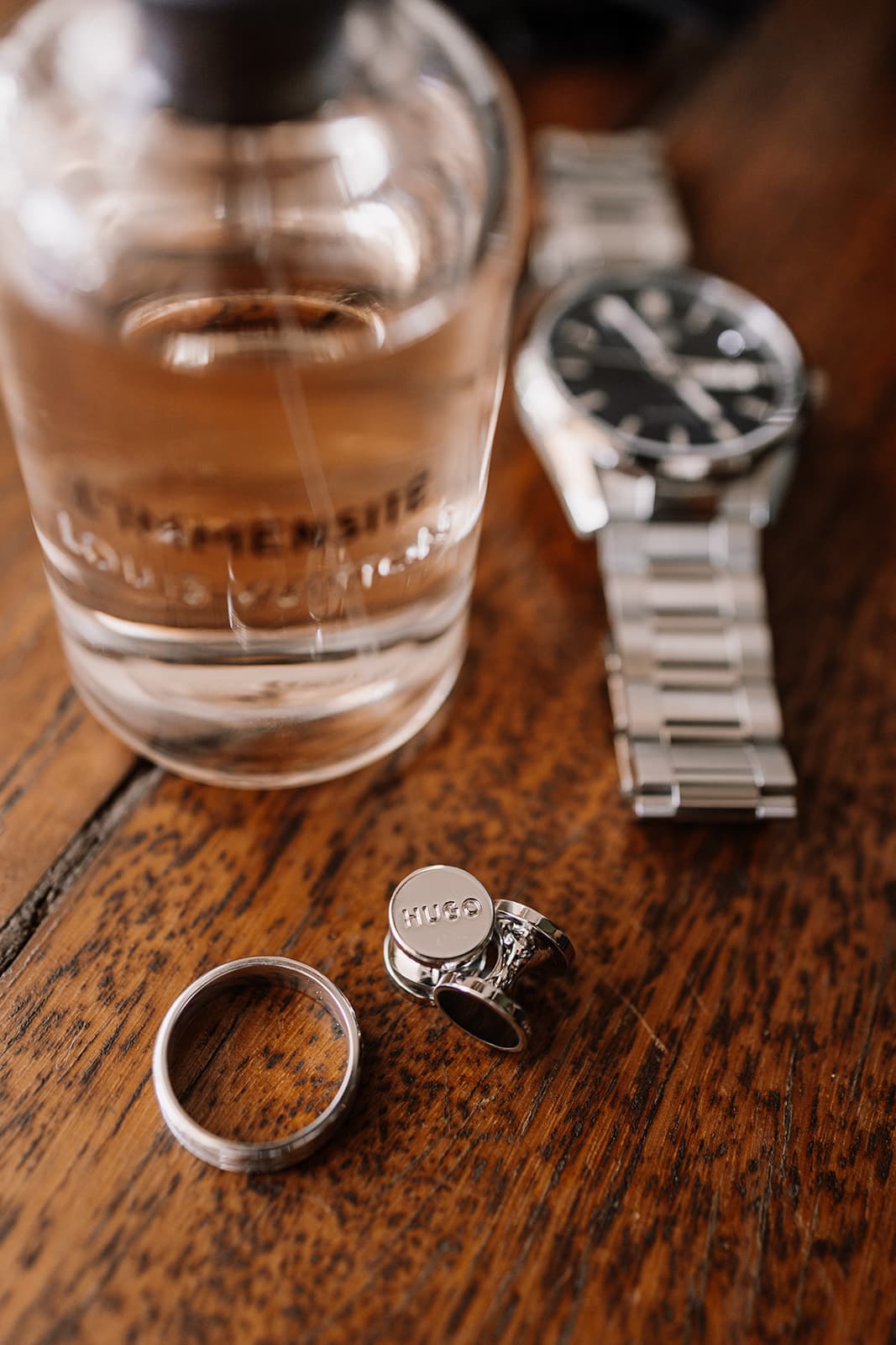 Watch, cufflinks, wedding band and cologne