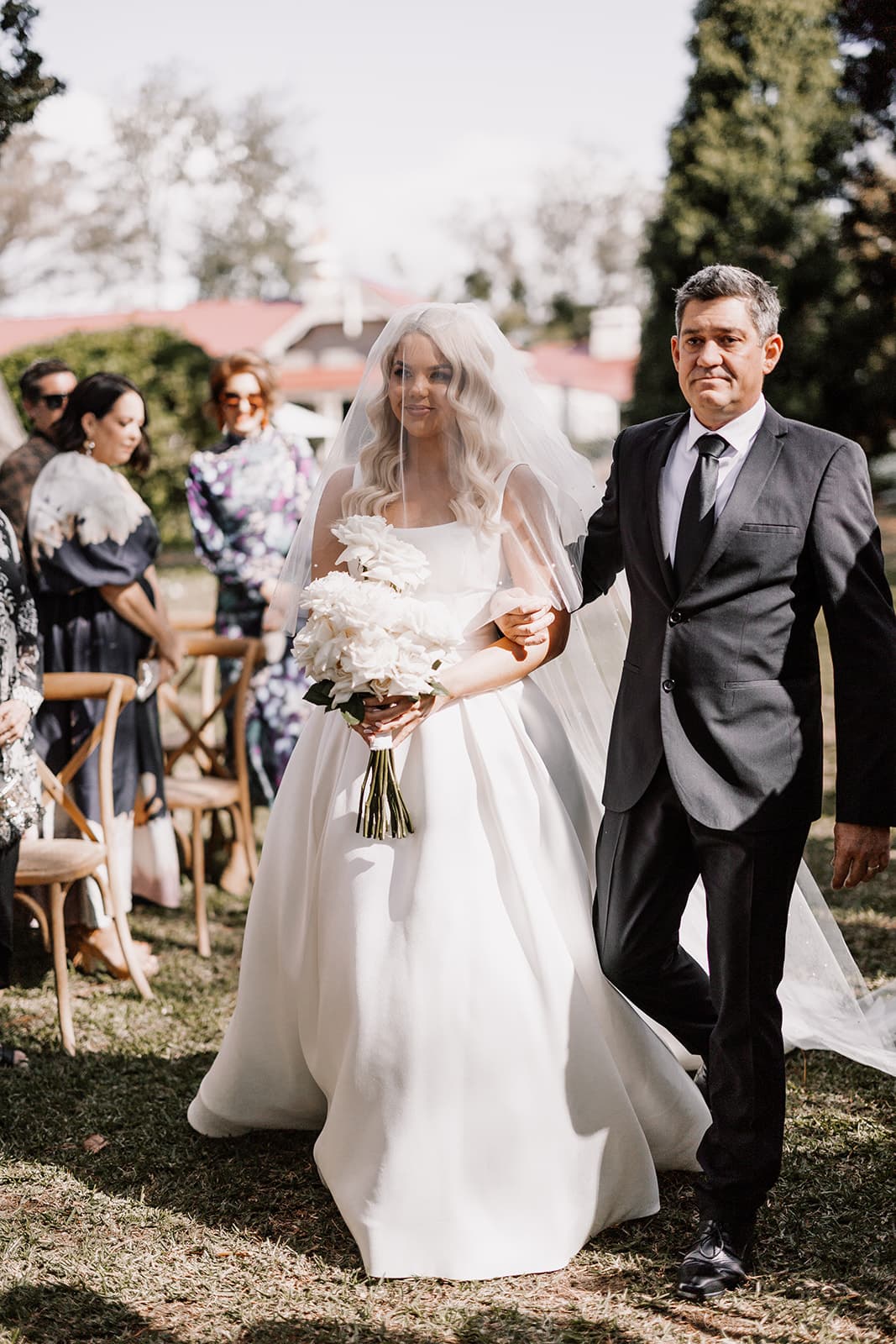 Bride and father walking down the aisle