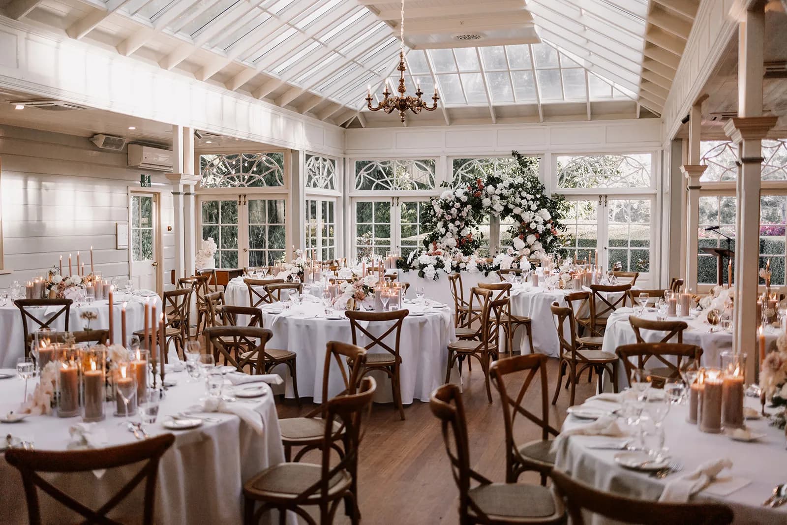 Wedding reception with candles and flroal arbour