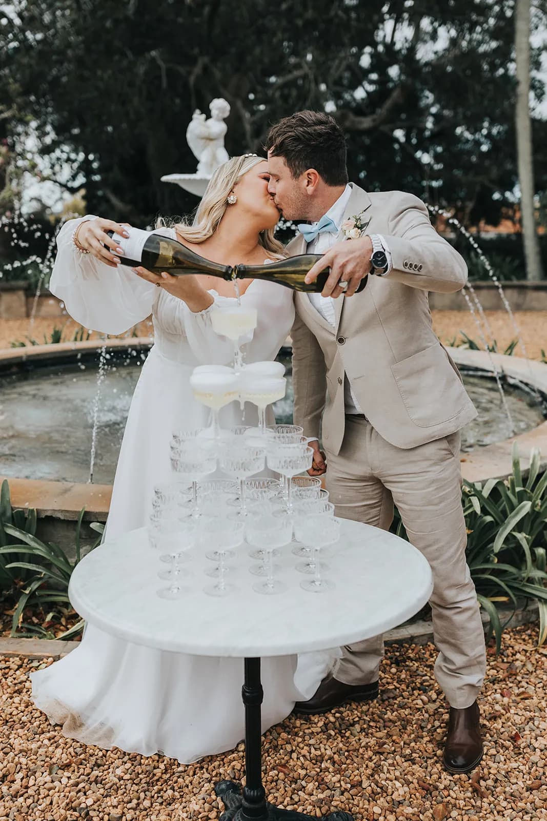 Bride and groom pouring champagne