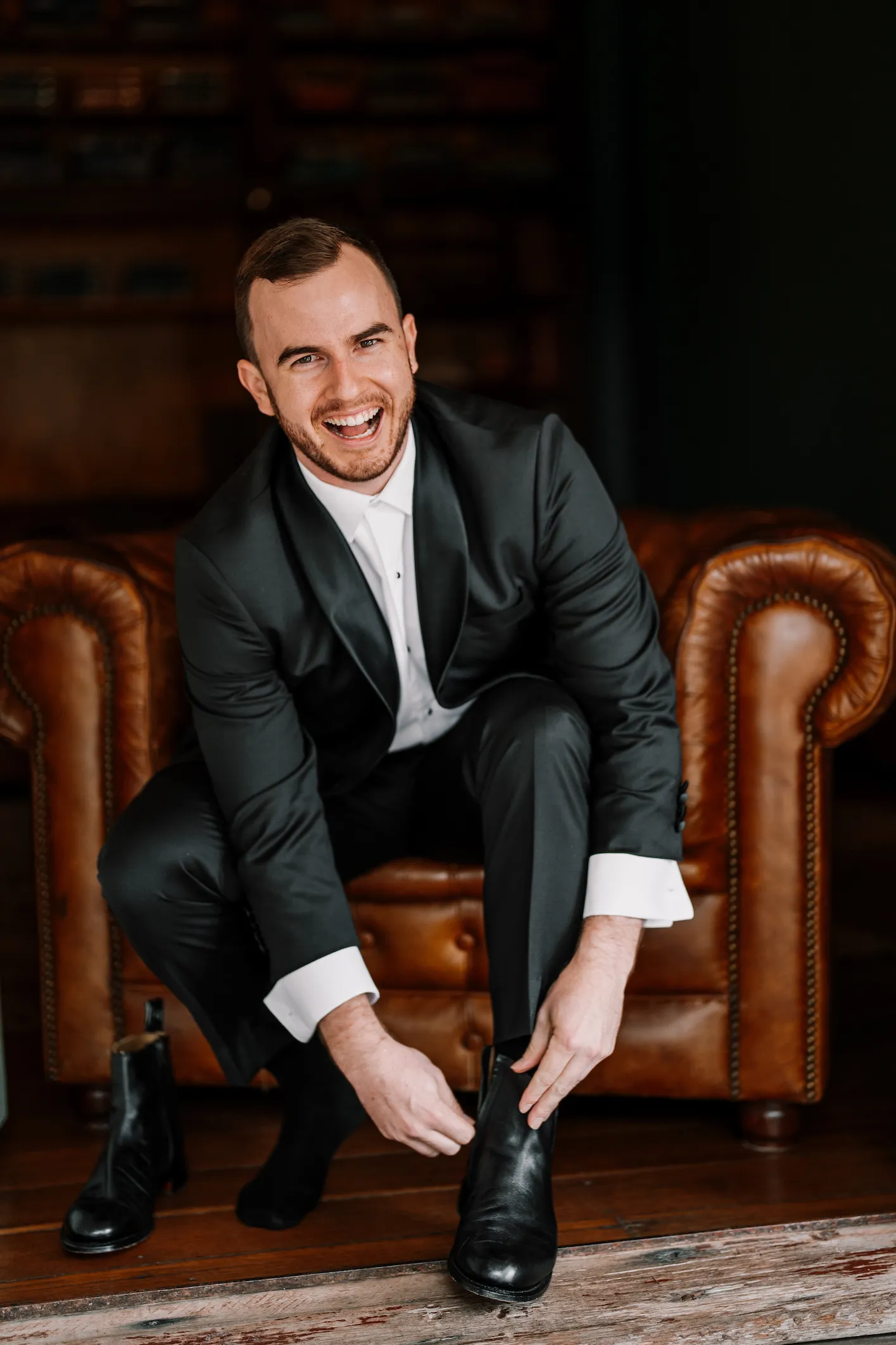 Groom doing up shoe laces