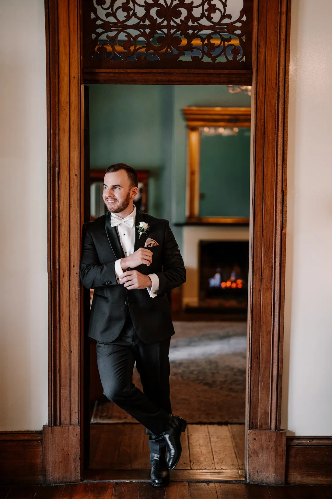 Groom standing in doorway