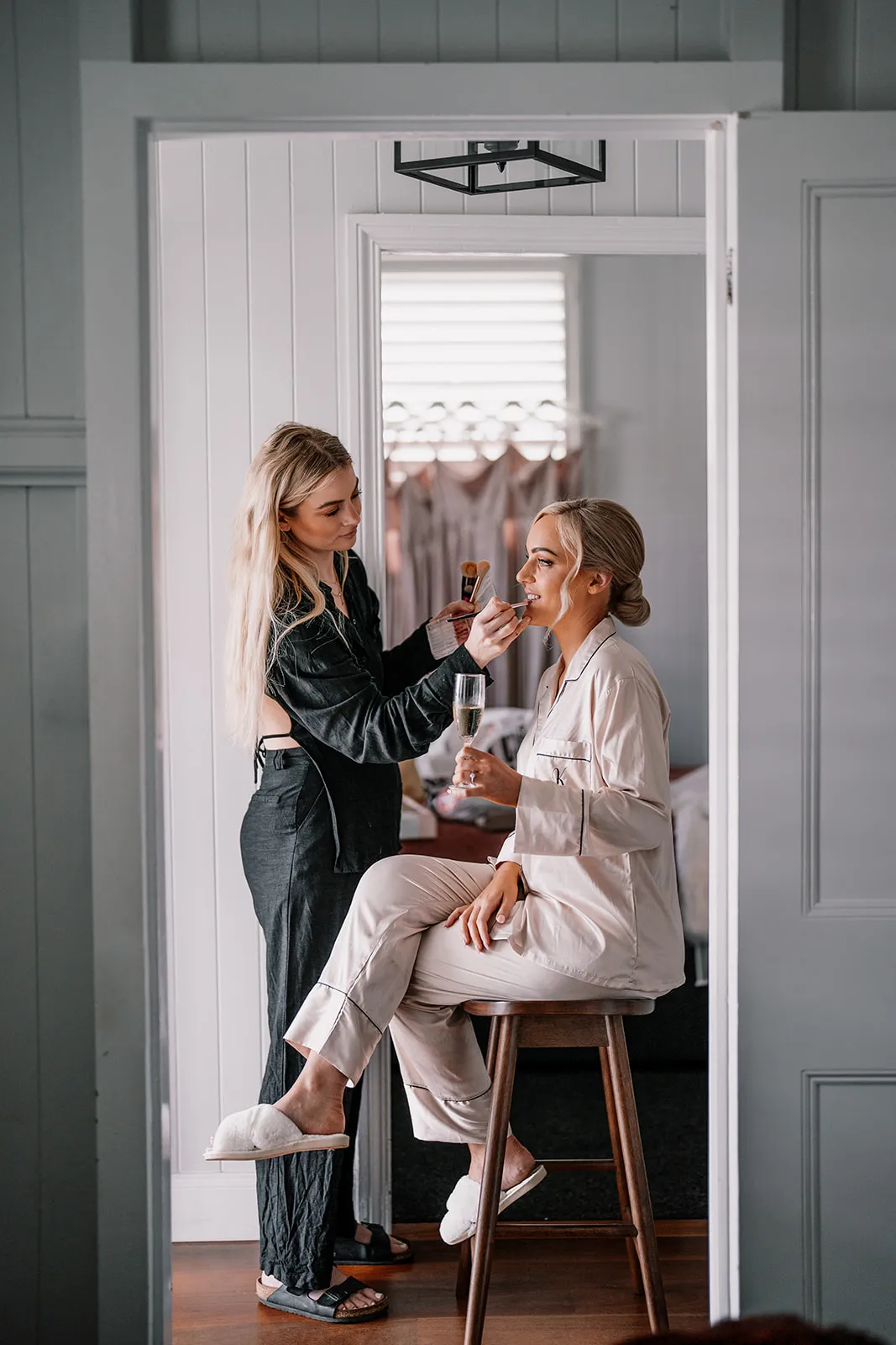 Bride having makeup applied