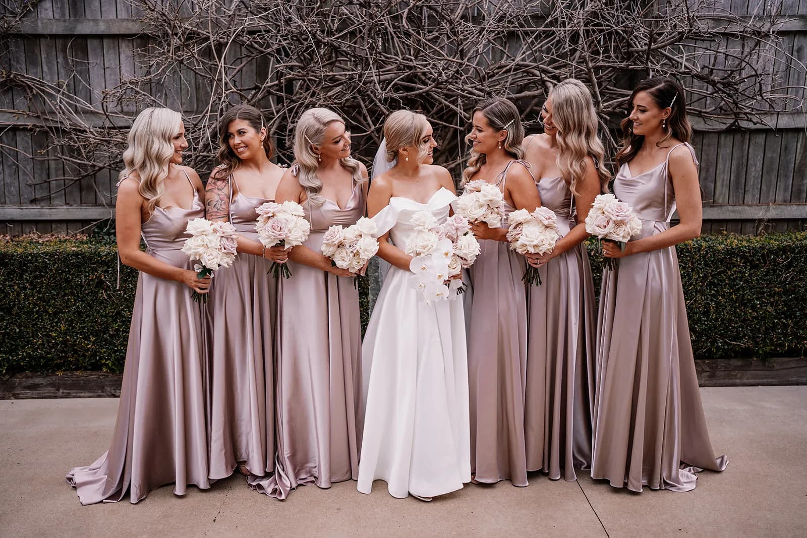 Bride and bridesmaids holding bouquet