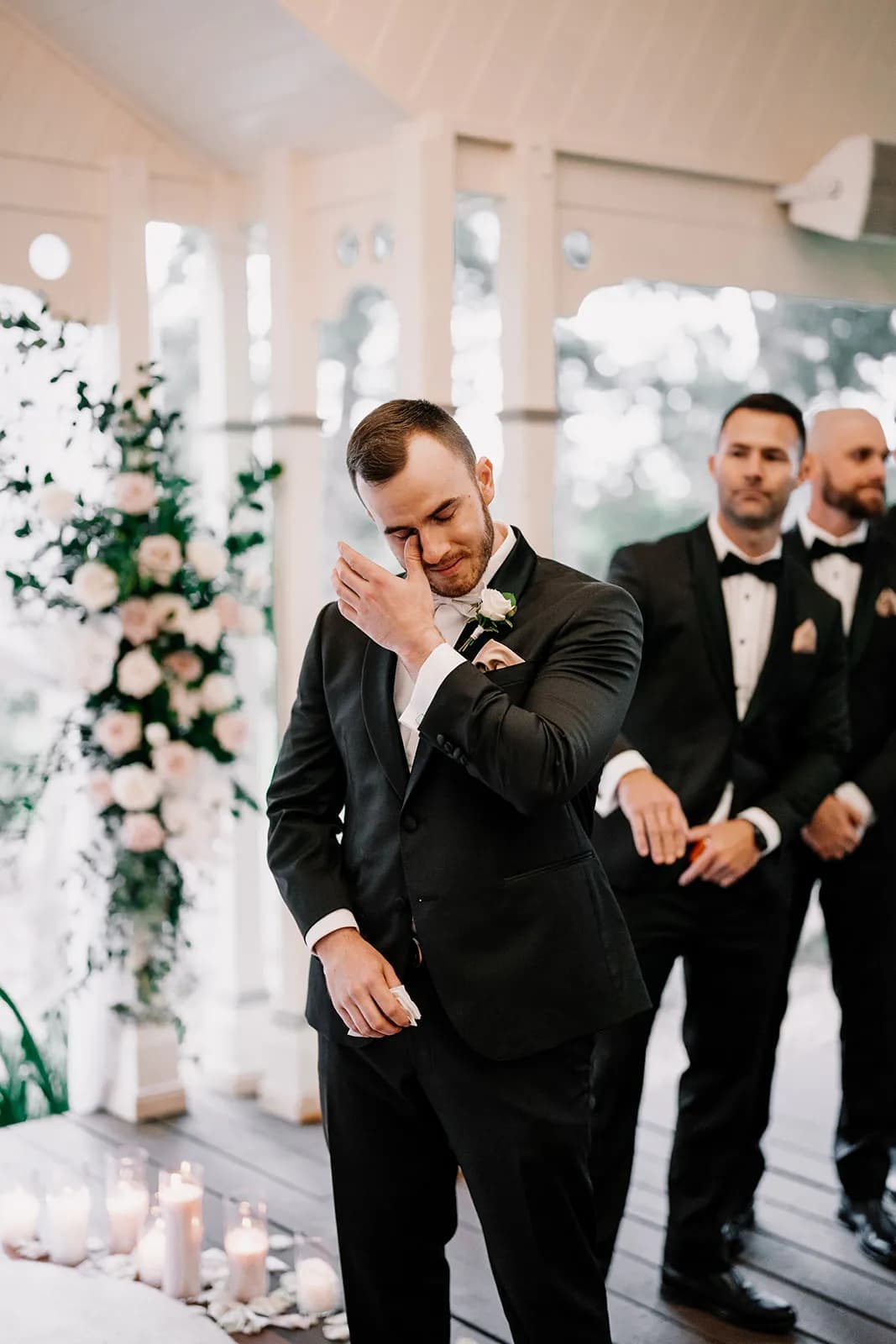 Groom crying at altar