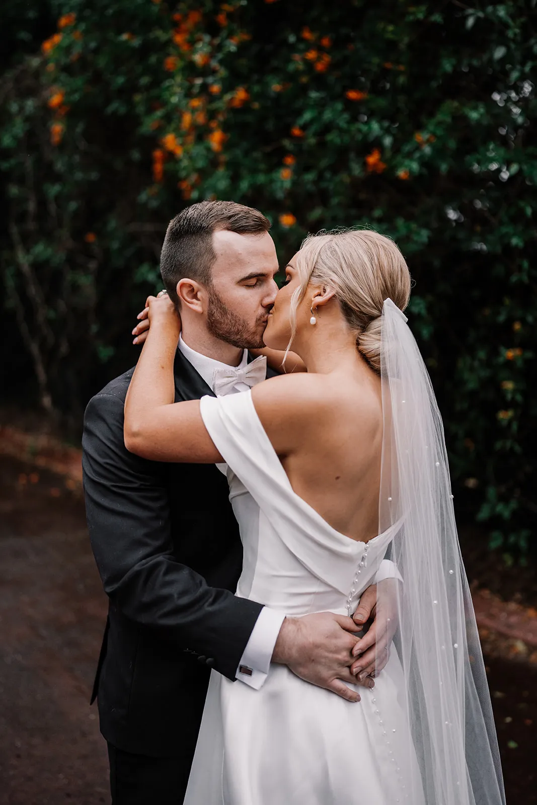 Bride and groom kissing