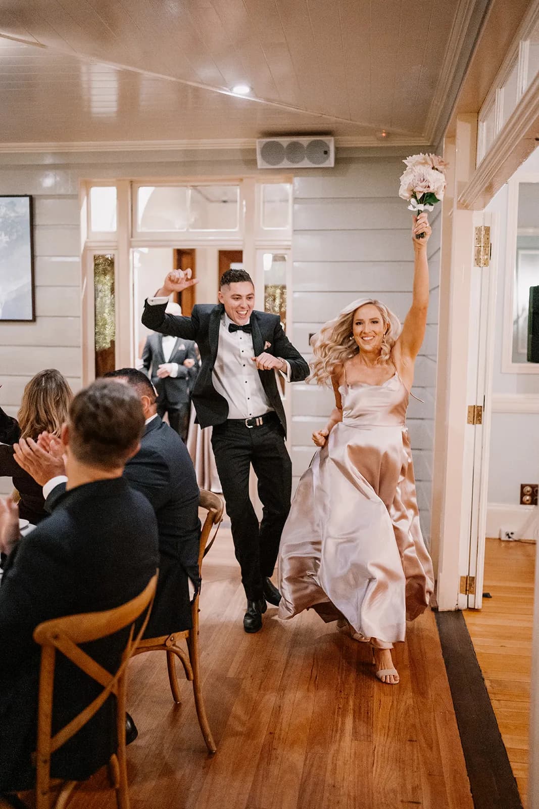 Bridesmaid walking into wedding reception