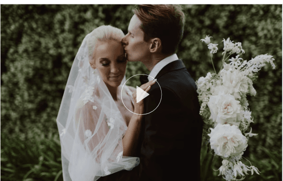 newlyweds embrace as they pose for wedding photographs at gabbinbar