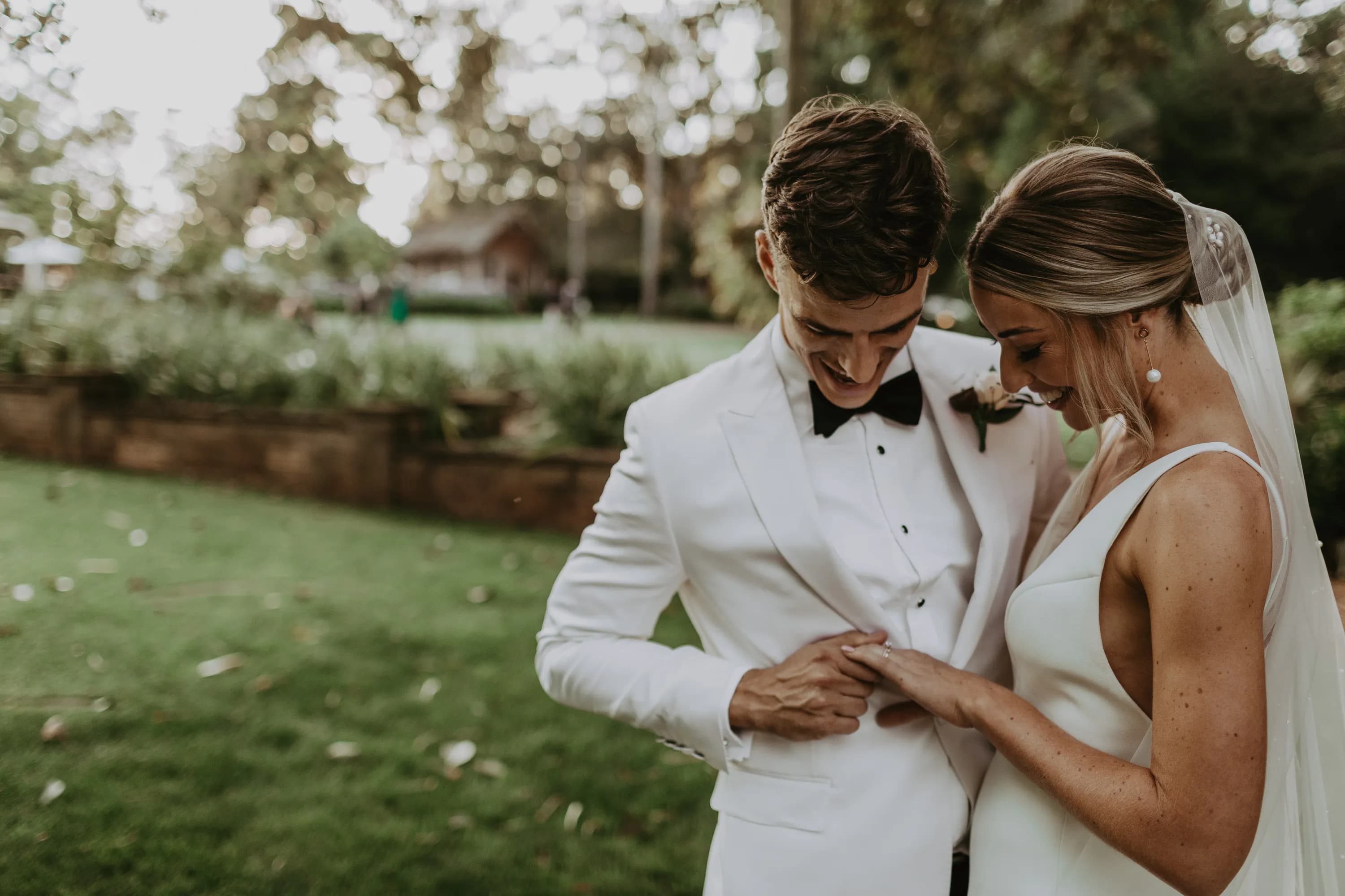Bride and groom looking at rings