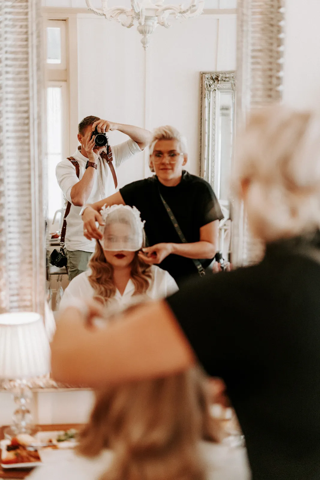 Hairdresser doing brides hair
