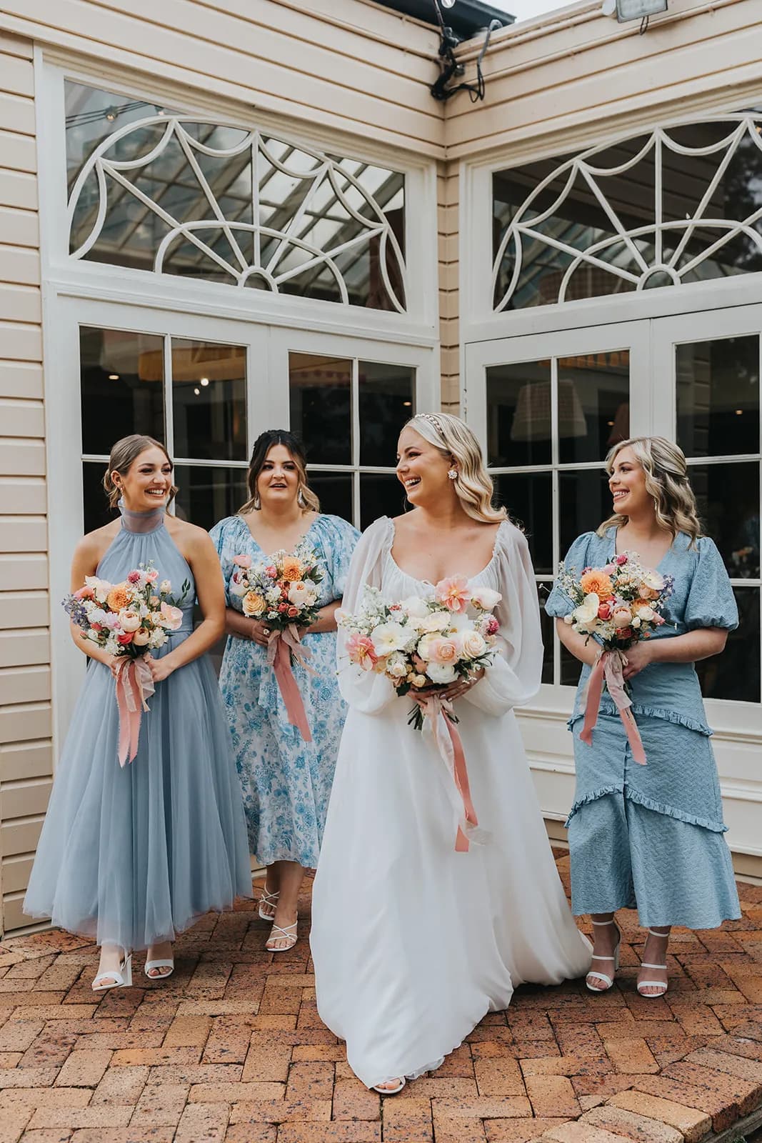 Bride and bridesmaids holding flowers