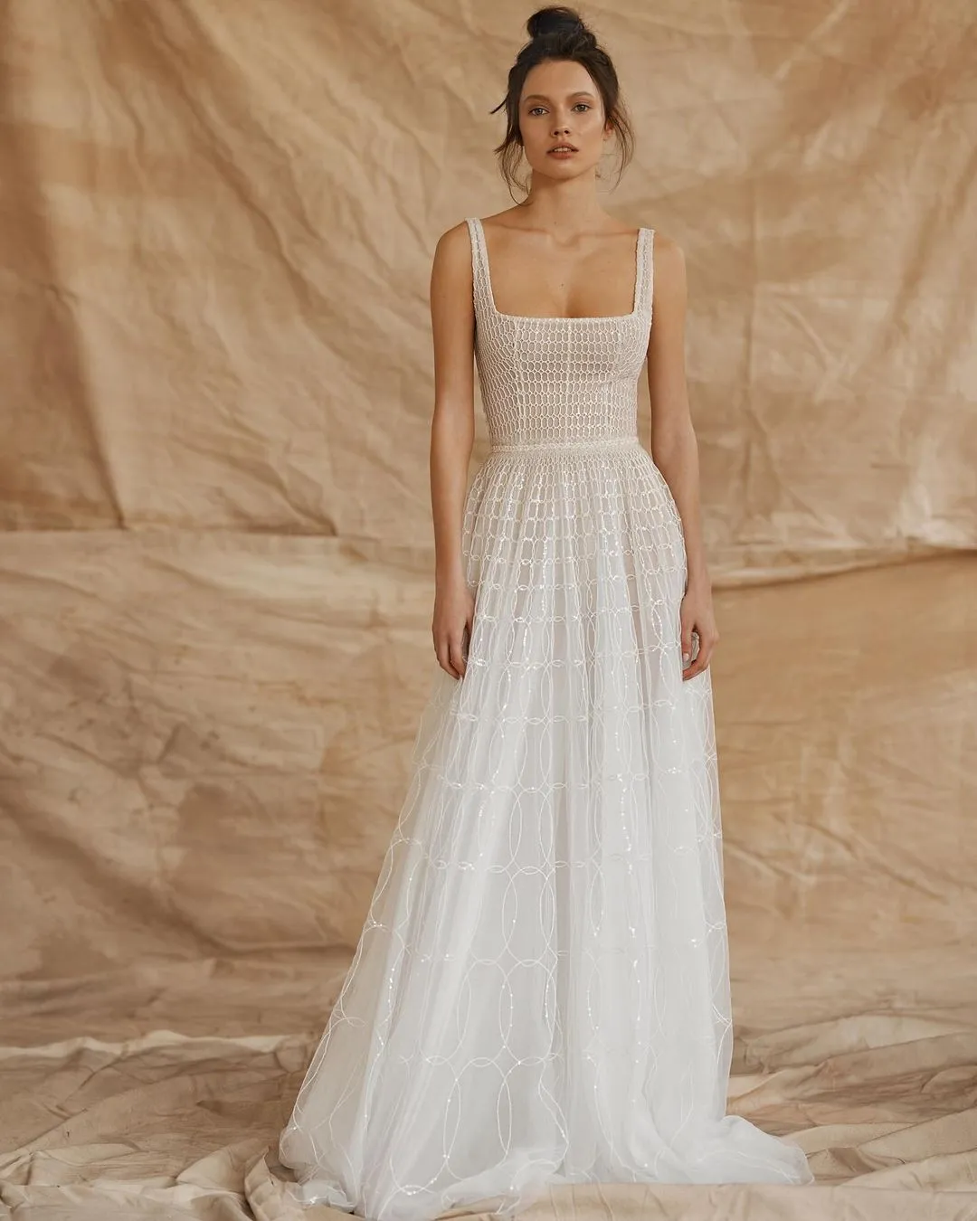 Bride wearing square neckline wedding dress