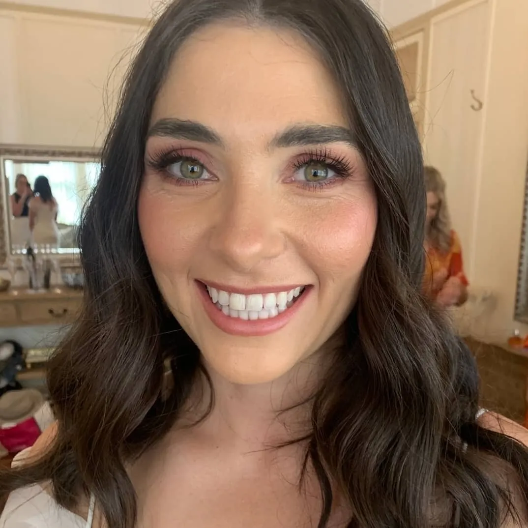 Bride smiling with makeup on