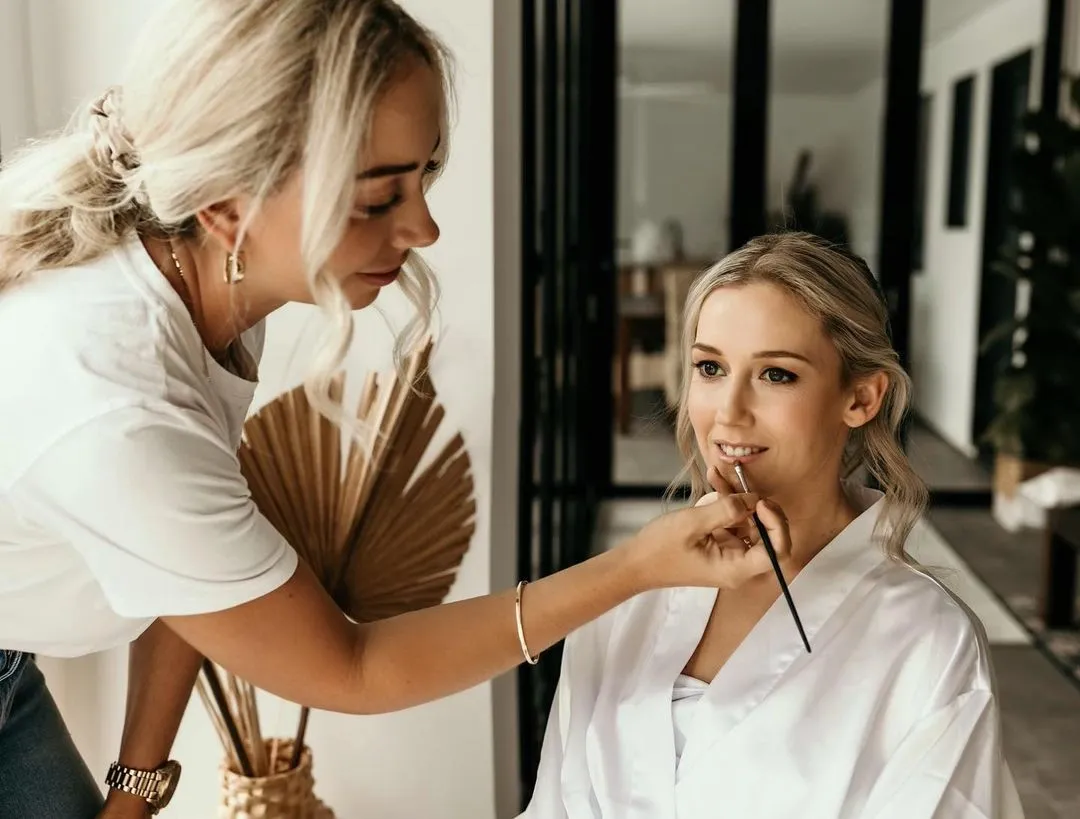 Bride getting makeup applied