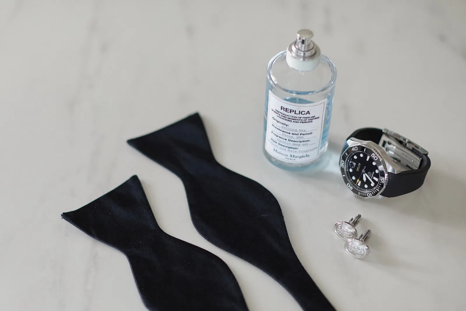 Groom bow tie, cologne, cufflinks and watch