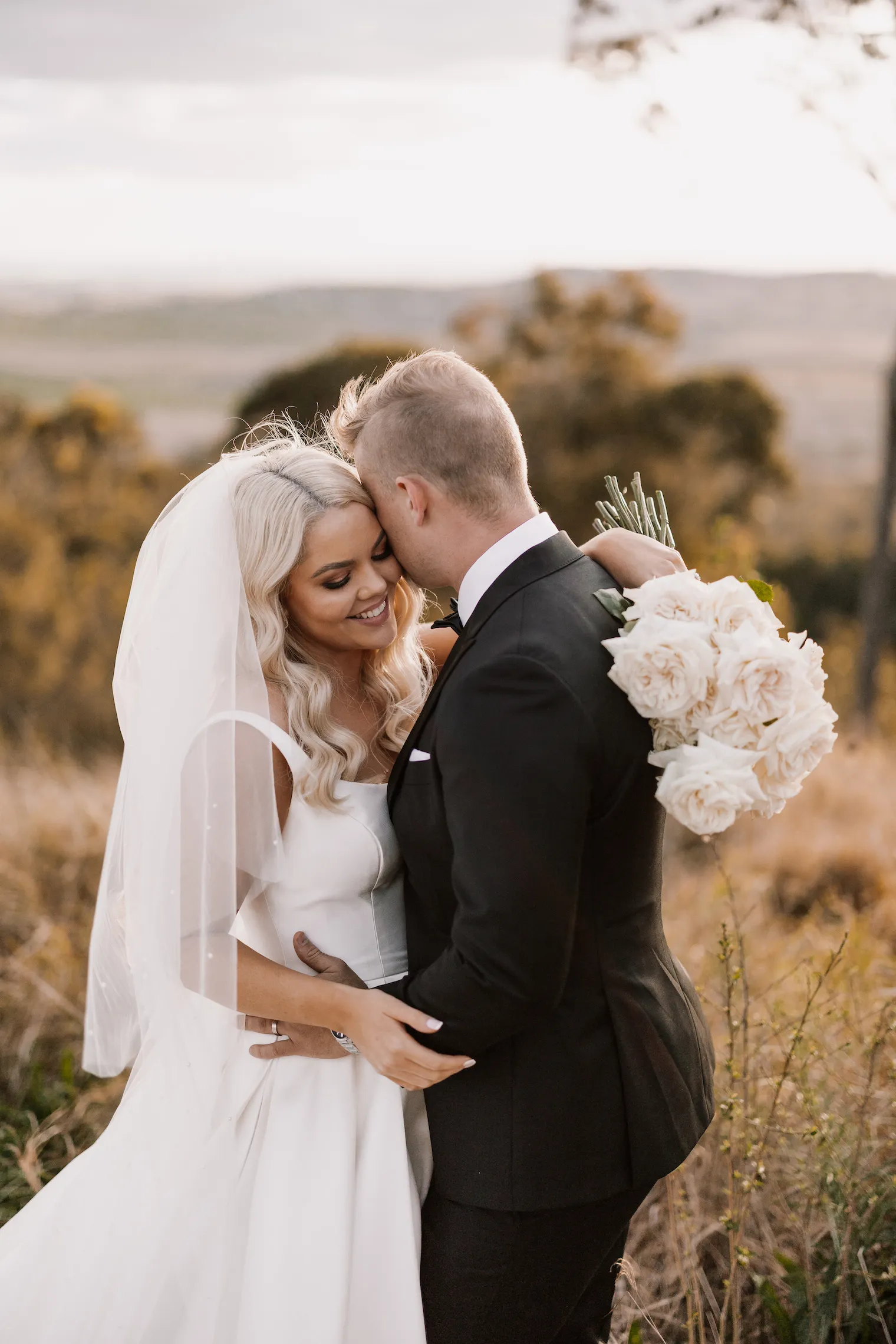 Bride and groom hugging