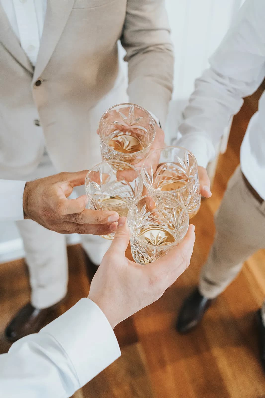 Groomsmen having a whisky