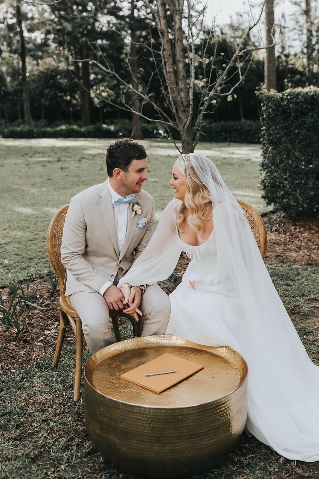 Bride and groom signing marriage certificate