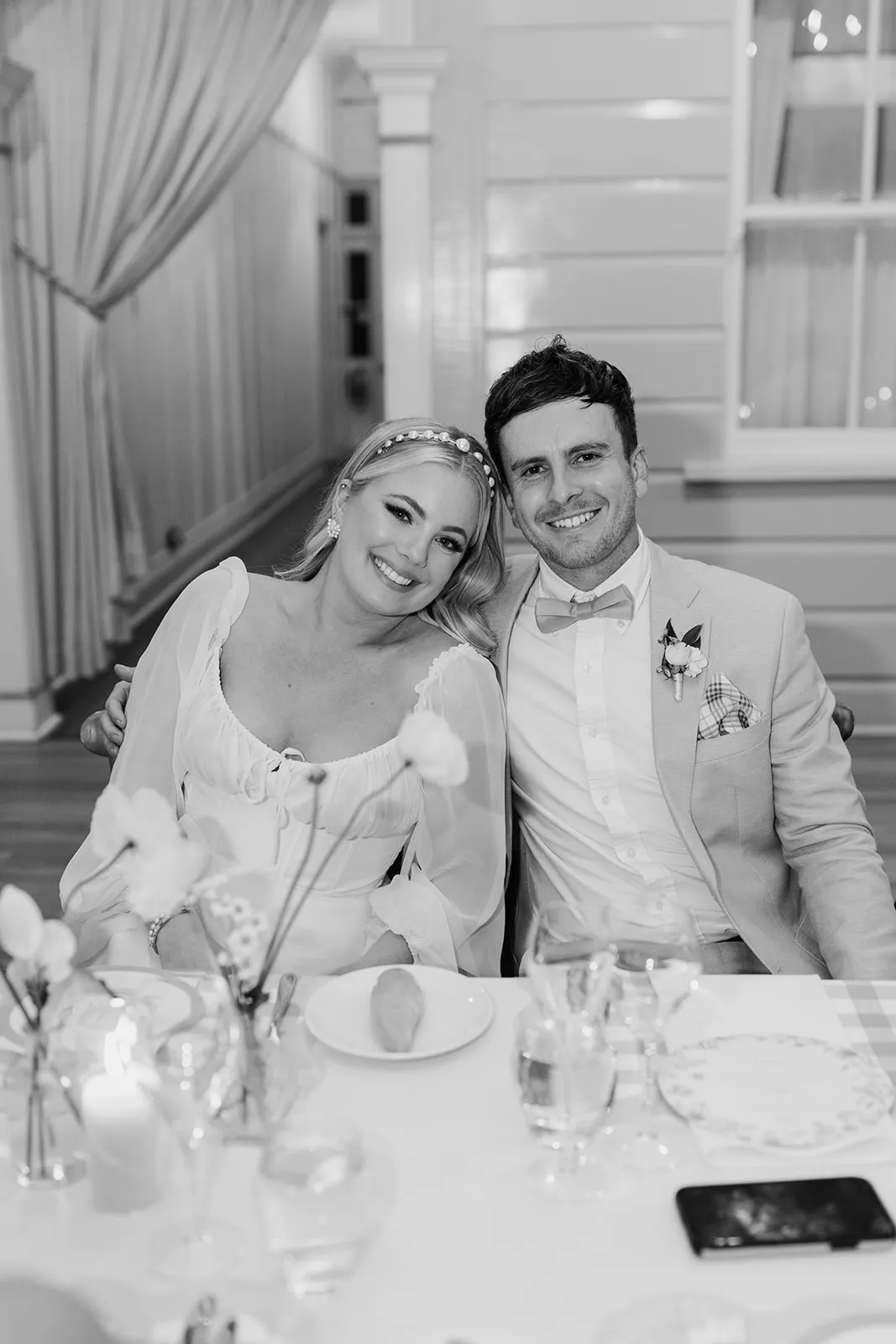 Bride and groom sitting in reception