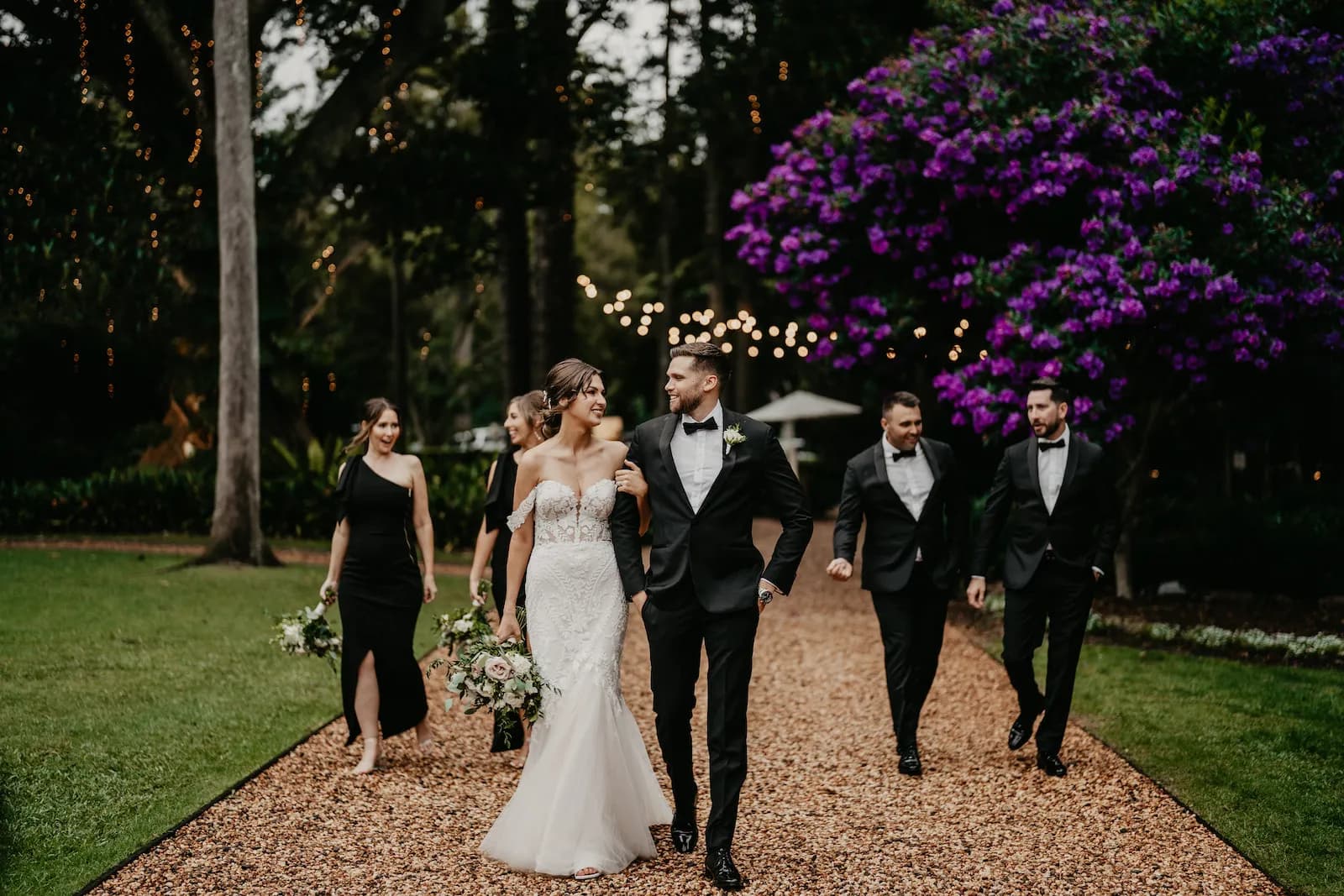Wedding party walking down the driveway